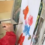 A pre-school child painting