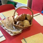 A wicker basket filled with fresh bread