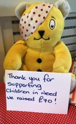 A Pudsey teddy bear holding a sign to say thank you for raising £70 for Children in Need