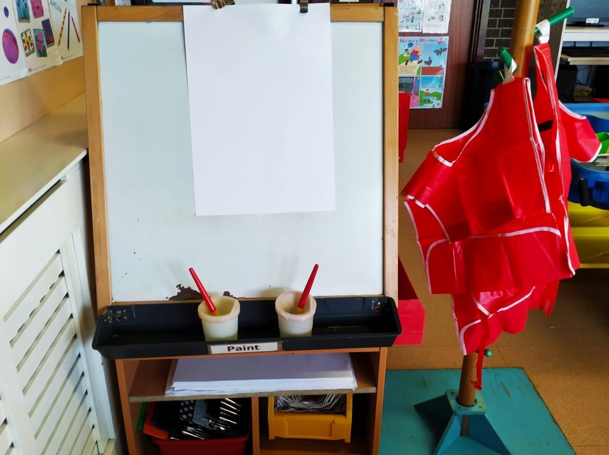 An easel setup for pre-school children to paint