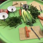 A table with parsley, carrots and leeks