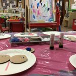 Creating creatures from circular cut cardboard, googly eyes and pipe cleaners