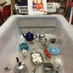 A scene of teapots, mugs and tea with tigres