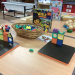 A table with various toys, puzzles and games
