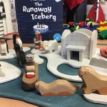 A tuff train filled with icebergs, penguins, seals and Eskimos