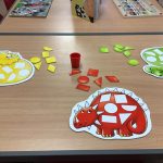 A table with dinosaur shape puzzles
