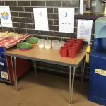 A table filled with various snacks and drinks