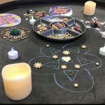 A table covered in flower art and candles